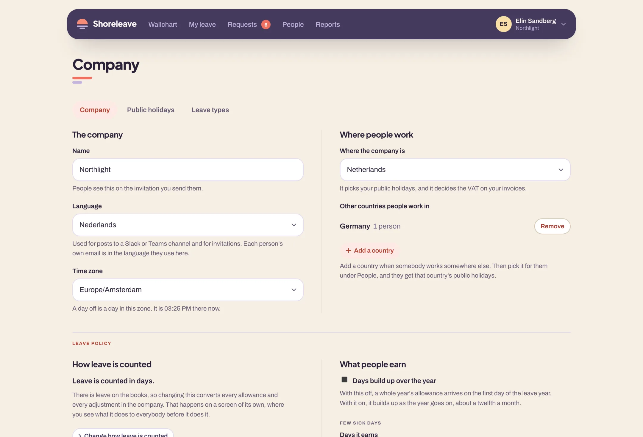 The company settings in Shoreleave: the name, the language and the time zone on one side, the countries people work in on the other, and the leave policy starting underneath.